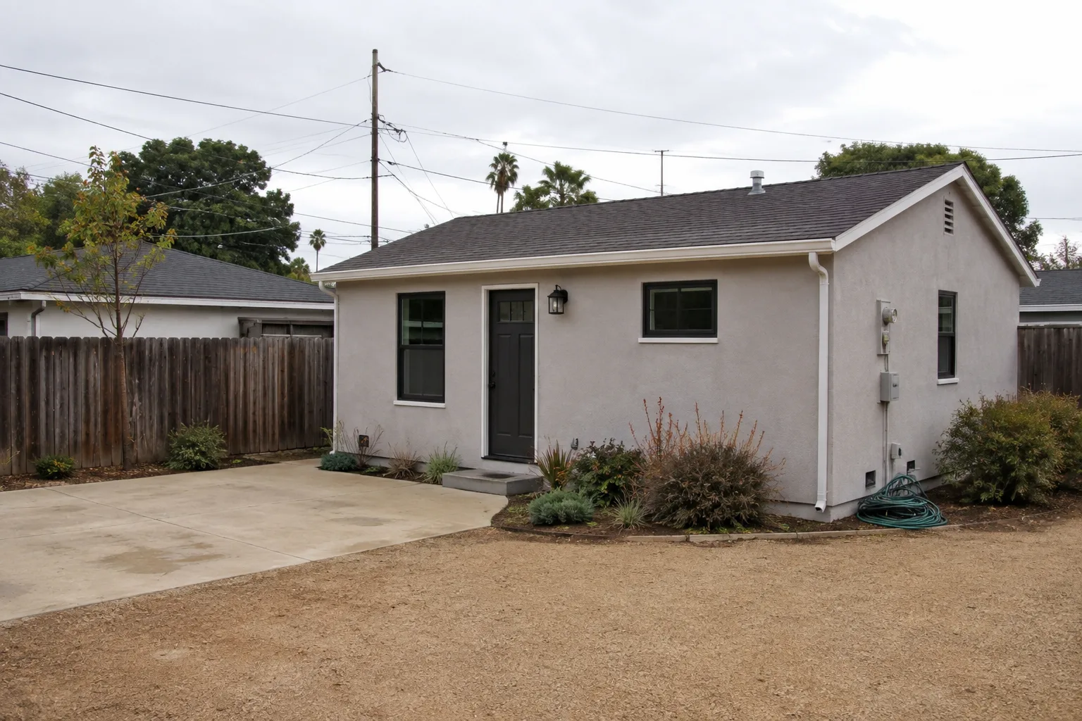 AI design concept of a detached backyard ADU in an established Southern California neighborhood